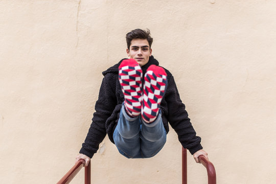 Young man showing socks