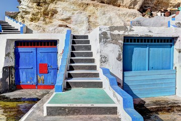 Naklejka premium Boat houses in the harbour of Mandrakia village on the northern coast of Milos Island, Greece