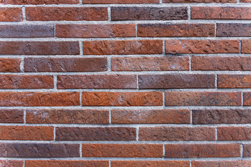 brick wall of bricks of different colors close-up