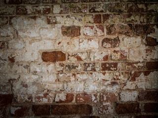 Threadbare surface of ancient masonry, abstract background with old brick wall.