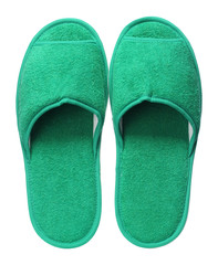 Green hotel slippers isolated on white background. Close up, high resolution