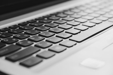 Laptop keyboard with focus on the keys close-up