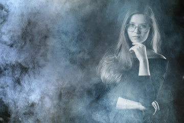 portrait of a woman in a smoke, eyes in glasses / business concept, beautiful woman, sexy business girl. Stress, smoking, relaxed.
