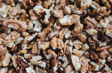Shelled walnuts background. Nuts texture. Healthy energy vegan food. Superfood for hipster lifestyle.