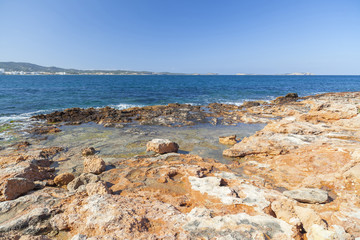 Fototapeta na wymiar Mediterranean sea, coastal view, rock formation, town of Sant Antoni, Ibiza Island,Spain.