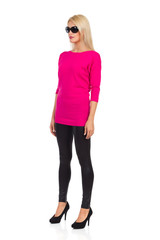 Fototapeta premium Beautiful Blond Woman In Sunglasses Is Standing At Attention. Front Side View.