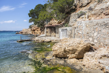 Shipyard huts, cultural interest close to sea, town of Sant Antoni, Ibiza Island,Spain.