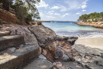 Fototapeta na wymiar Mediterranean beach, Cala Gracioneta, town of Sant Antoni, Ibiza island,Spain.