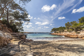 Fototapeta na wymiar Mediterranean beach, Cala Gracioneta, town of Sant Antoni, Ibiza island,Spain.