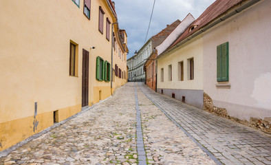 Colorful houses at a cobblestoned street in Sibiu, Romania