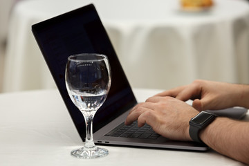 Business man typing on laptop