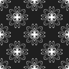 Floral black and white ornament. Seamless abstract classic background with flowers. Pattern with repeating elements