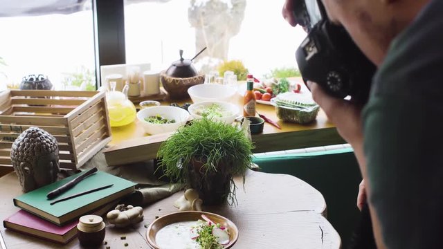 Pro photographer shooting food in restaurant