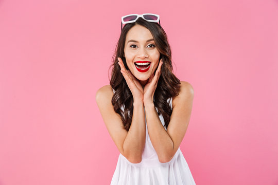 Surprised young asian woman wearing sunglasses