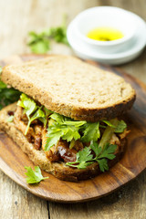 BBQ chicken sandwich on a dark rye bread