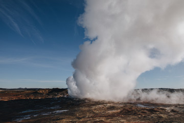 Fototapeta na wymiar spectacular landscape with steam from geothermal hot springs in iceland, reykjanes, Gunnuhver Hot Springs