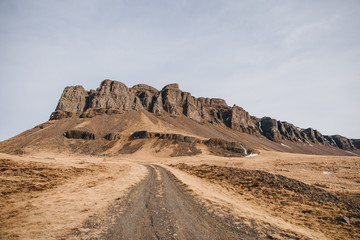 Fototapeta na wymiar beautiful icelandic landscape with rural road and rocks, hvalfjardarvegur