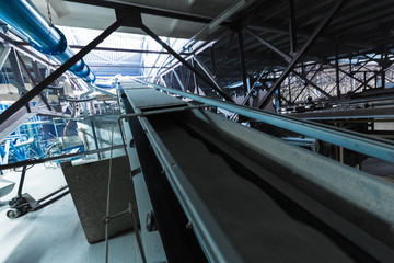 Fiberglass production industry equipment at manufacture background