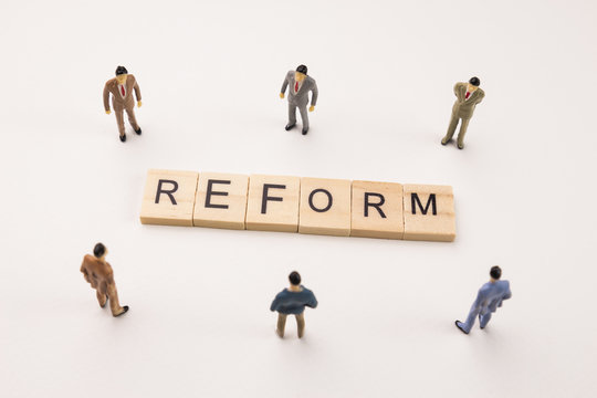businessman figures meeting on reform conceptual