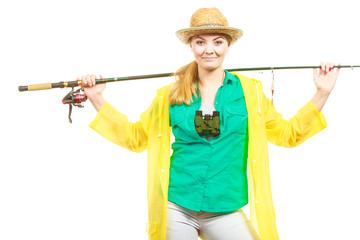 Woman with fishing rod, spinning equipment