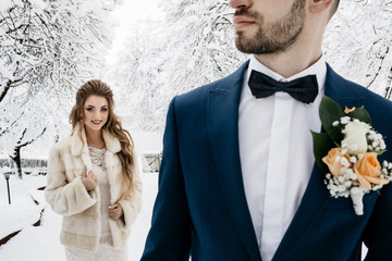 Beautiful wedding couple on their winter wedding