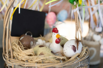 decorative chicken in a basket with eggs