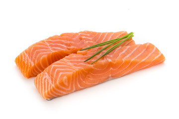 Fresh salmon fillet with basil on the white background.