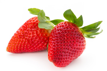 Fresh strawberries close up on white background.