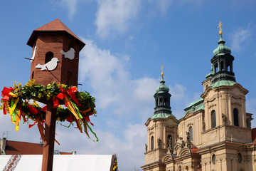 Celebrate easter on Old Town square. View on a Church of St. Nicholas