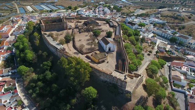 Aerial. The village of Castro Marim and the castle, filmed from sky drone.
