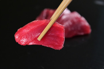  Macro shot of sushi, sashimi, uramaki and nighiri. typical Japanese dish consisting of rice, salmon or tuna,shrimp and fish eggs soaked in soy. Concept: Japanese restaurant, sushi,  - obrazy, fototapety, plakaty