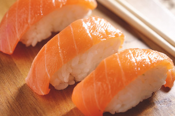  Macro shot of sushi, sashimi, uramaki and nighiri. typical Japanese dish consisting of rice, salmon or tuna,shrimp and fish eggs soaked in soy. Concept: Japanese restaurant, sushi, 