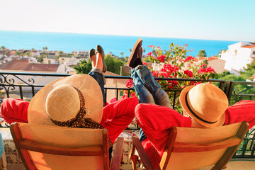 happy couple relax on balcony terrace, on vacation in Europe