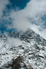 Snowy Mountain Himalayas peaks landscape of Moon Peak, Indarhar pass, Dhauladhar Range cloudy sky