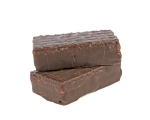 two waffle candies in chocolate on a white background