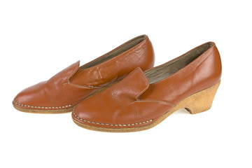 female shoes in orange heeled used on a white background