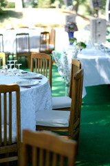Outdoor wedding reception table. Angle view over a wedding reception table in the courtyard mansion.