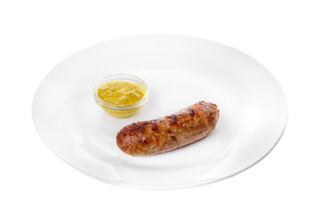 Sausage, beef, lamb, skinnut, grilled meat, barbecue, without garnish on a plate, isolated on white background. Mustard, yellow sauce. For the menu in the restaurant, bar Side view