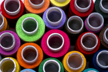 Spools multi-colored threads.