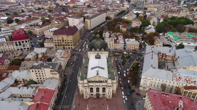 Aerial view of Lviv and central theatre, traffic and people. Ukraine 4k