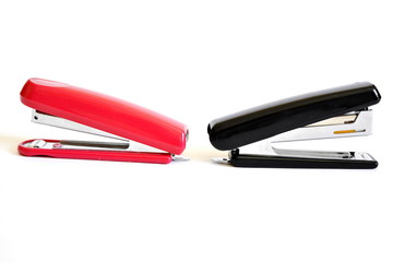 Red and black stapler. Isolated. White background. 