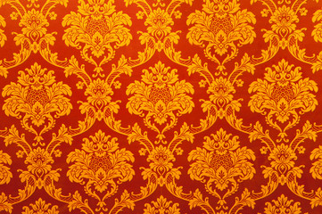 Vintage Indian golden wallpaper. Vintage Indian golden wallpaper with different texture and ornaments on the red background.