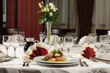 Luxury white wedding reception dinner table.
