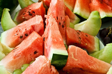 Closeup fresh melon slices on the plate.