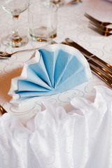 Wedding arrangement. Blue napkin with decoration on wedding arrangement.