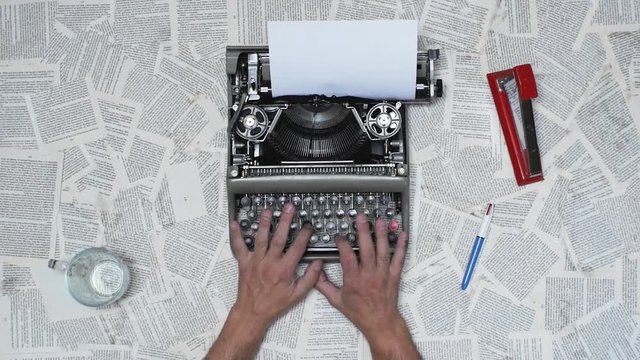 Person typing on a vintage typewriter with vintage 35mm camera, after an adventurous trip, Taking notes and ideas . Different styles available in my gallery color and Black and white