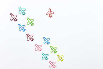 Business concept for group of plane paperclip point to one direction with another one red individual plane paperclip is point to another direction