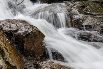Obraz premium Waterfall from snow melt in the mountains of Madrid, Spain