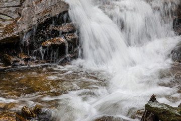 Fototapeta premium Waterfall from snow melt in the mountains of Madrid, Spain