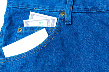 Large stack of money in the pocket of old vintage indigo stonewashed jeans. Modern trendy color